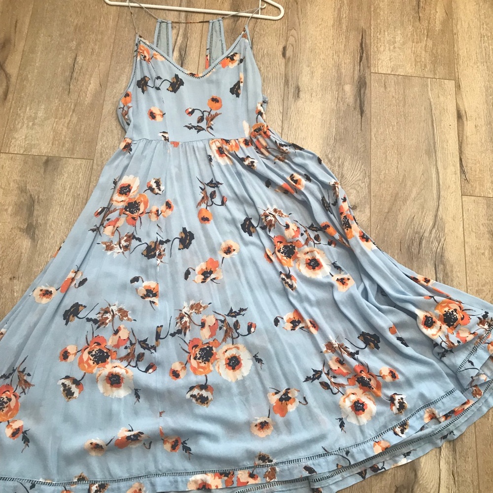 Long floral dress with cute back.